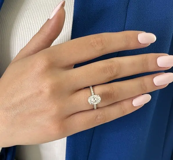 Oval Halo Engagement Rings on a Finger of a hand model