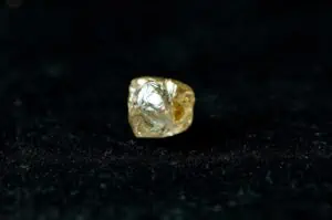 Yellow diamond shown as part of the 5 cs of a diamond