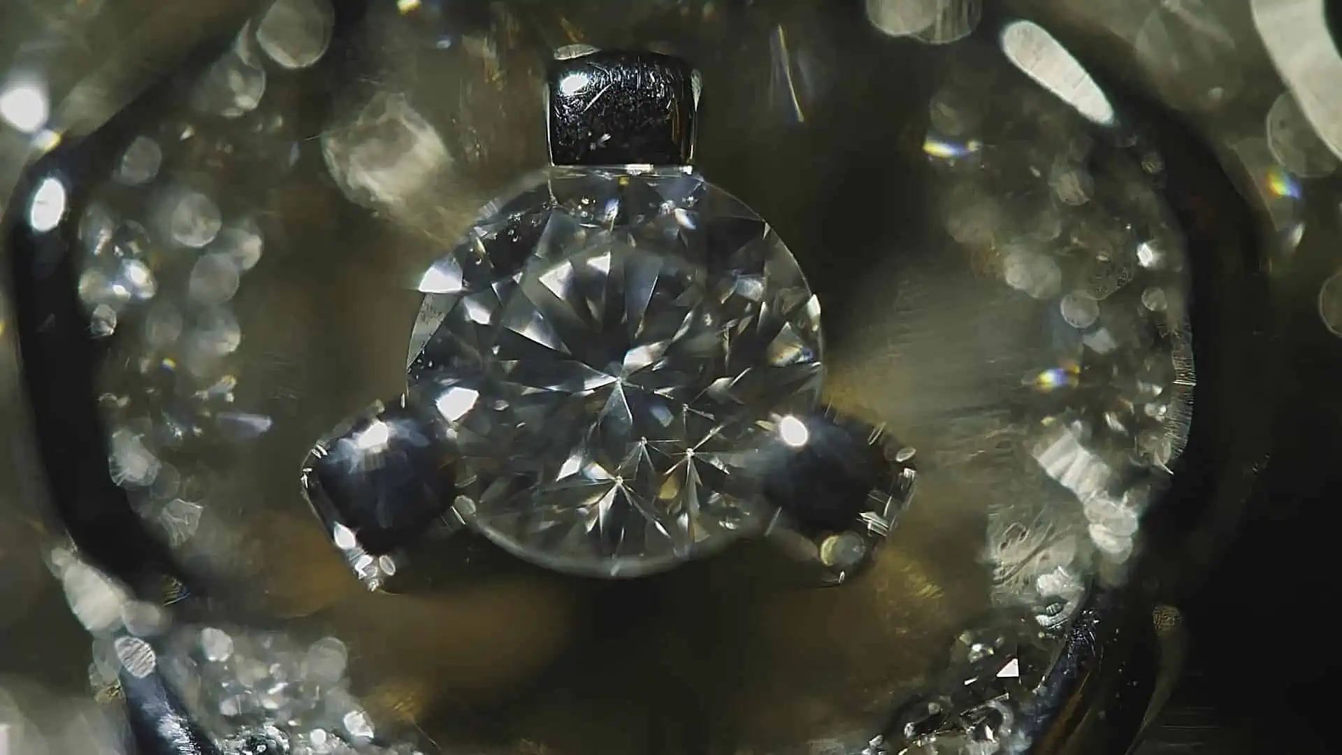 diamond under a magnifying glass to check if it's real diamond or fake diamond