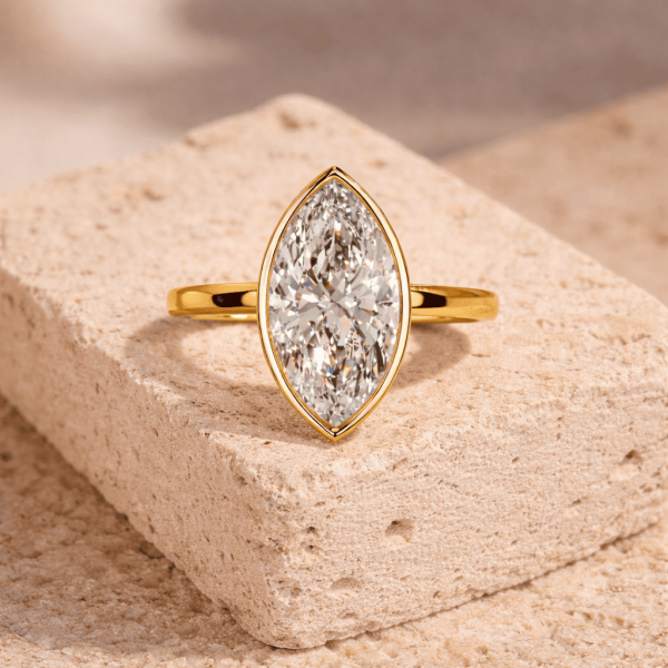 Bezel setting, 3 carat marque diamond engagement ring