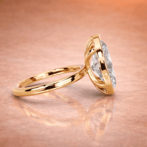 Side View Of Yellow Gold Marque diamond bezel setting